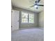 Spacious bedroom with neutral walls and carpet flooring at 6733 Walker Rd, Riverdale, GA 30296