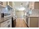 Renovated kitchen with granite counters and stainless steel appliances at 6733 Walker Rd, Riverdale, GA 30296