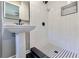 Updated bathroom with subway tile shower and black accents at 6733 Walker Rd, Riverdale, GA 30296