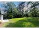 Large backyard with grassy area and patio at 6733 Walker Rd, Riverdale, GA 30296