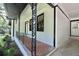 Charming front porch with brick flooring and metal railing at 6733 Walker Rd, Riverdale, GA 30296
