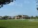 Community clubhouse with green space and golf course view at 4847 Basingstoke Dr, Suwanee, GA 30024