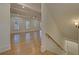 Spacious living room with hardwood floors and coffered ceilings at 4847 Basingstoke Dr, Suwanee, GA 30024