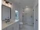 Modern bathroom with white vanity, frameless shower, and stylish fixtures at 4847 Basingstoke Dr, Suwanee, GA 30024