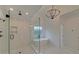 Spa-like bathroom with soaking tub, walk-in shower, and marble tile at 4847 Basingstoke Dr, Suwanee, GA 30024