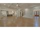 Spacious Gathering room with hardwood floors, high ceilings, and open kitchen at 4847 Basingstoke Dr, Suwanee, GA 30024