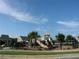 playground with a slide and climbing structure, enclosed by a fence at 4847 Basingstoke Dr, Suwanee, GA 30024