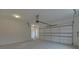 Garage with automatic door opener and window at 4847 Basingstoke Dr, Suwanee, GA 30024