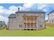 Two-story home with brick exterior and large deck at 4847 Basingstoke Dr, Suwanee, GA 30024