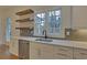 Kitchen with white cabinets, quartz countertops, and a farmhouse sink at 4847 Basingstoke Dr, Suwanee, GA 30024