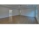 Bright bedroom with hardwood floors, access to bathroom and additional room at 4847 Basingstoke Dr, Suwanee, GA 30024