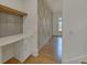 Home office with built-in shelving and wood-paneled accent wall at 4847 Basingstoke Dr, Suwanee, GA 30024
