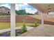 Covered porch with stone flooring and views of neighborhood at 4847 Basingstoke Dr, Suwanee, GA 30024