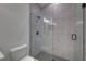 Bathroom with grey tile shower and hexagon floor tile at 4847 Basingstoke Dr, Suwanee, GA 30024