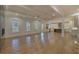 Open-concept Gathering room with hardwood floors and coffered ceiling at 4847 Basingstoke Dr, Suwanee, GA 30024