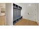 Mudroom with built-in bench and storage cubbies at 4847 Basingstoke Dr, Suwanee, GA 30024