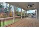 Spacious screened porch with wooded views and ceiling fan at 4847 Basingstoke Dr, Suwanee, GA 30024