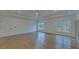 Large bedroom with hardwood floors and multiple windows at 4847 Basingstoke Dr, Suwanee, GA 30024