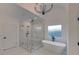 Bathroom with soaking tub, walk-in shower, and marble tile at 4847 Basingstoke Dr, Suwanee, GA 30024