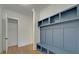 Mudroom with built-in bench, cubbies, and closet at 4847 Basingstoke Dr, Suwanee, GA 30024