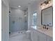 Bathroom with a walk-in shower, white vanity, and quartz countertop at 4847 Basingstoke Dr, Suwanee, GA 30024