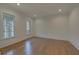 Bright home office with hardwood floors and large windows at 4847 Basingstoke Dr, Suwanee, GA 30024