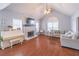 Living room featuring vaulted ceiling, fireplace, and large sectional sofa at 3095 Willow Park Dr, Dacula, GA 30019