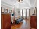 Spacious main bedroom with hardwood floors, a post bed, and ample natural light at 66 Danielle Dr, Dallas, GA 30157