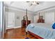 Main bedroom with hardwood floors, a large bed, and private access door at 66 Danielle Dr, Dallas, GA 30157