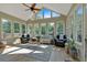 Bright sunroom with vaulted ceiling, hardwood floors, and plenty of windows at 66 Danielle Dr, Dallas, GA 30157