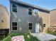 Two story home with gray siding and backyard patio at 8798 Seneca Rd, Palmetto, GA 30268