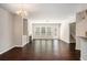 Living room with dark hardwood floors and a built in fire place at 3732 Upland Dr, Mcdonough, GA 30253