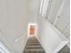 Carpeted staircase leading to the upper level of the home at 3853 Cress Way Dr, Decatur, GA 30034