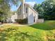Side view of two story house with driveway and landscaping at 3853 Cress Way Dr, Decatur, GA 30034