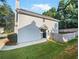 Gray house exterior with a black door, small patio, and fenced backyard at 3853 Cress Way Dr, Decatur, GA 30034