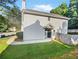 Gray house exterior with a black door, small patio, and fenced backyard at 3853 Cress Way Dr, Decatur, GA 30034
