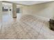 Open living area with tile floors and access to patio at 707 Pine Tree Trl # 10B, Atlanta, GA 30349