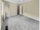 Spacious bedroom with grey carpet and access to another room at 707 Pine Tree Trl # 10B, Atlanta, GA 30349