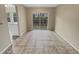 Bright dining room with tile floors and sliding glass doors at 707 Pine Tree Trl # 10B, Atlanta, GA 30349