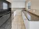 Modern kitchen featuring white cabinets and granite counters at 707 Pine Tree Trl # 10B, Atlanta, GA 30349