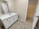 Clean bathroom with a white vanity and tub shower at 707 Pine Tree Trl # 10B, Atlanta, GA 30349