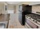 Updated kitchen features modern appliances and tile flooring at 707 Pine Tree Trl # 10B, Atlanta, GA 30349
