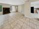Living room features tile floors and a stone fireplace at 707 Pine Tree Trl # 10B, Atlanta, GA 30349