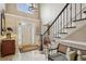 Bright foyer with high ceilings, staircase, and entry door at 3444 Paces Ferry Cir, Smyrna, GA 30080