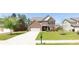 Brick house with a two-car garage and well-maintained lawn at 1505 Clubhouse Ct, Mcdonough, GA 30252