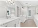 Elegant bathroom with double sinks, a soaking tub, and a walk-in shower at 1934 Granite Peak Nw Dr, Atlanta, GA 30318