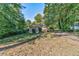 Cozy ranch-style house with a front yard and driveway at 276 Thompson St, Alpharetta, GA 30009