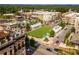 Aerial view of a town square with green space and surrounding buildings at 276 Thompson St, Alpharetta, GA 30009
