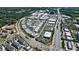 Aerial view of a mixed-use development with residential homes and commercial spaces at 276 Thompson St, Alpharetta, GA 30009
