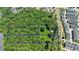 Aerial view of large wooded lot next to townhouses at 276 Thompson St, Alpharetta, GA 30009